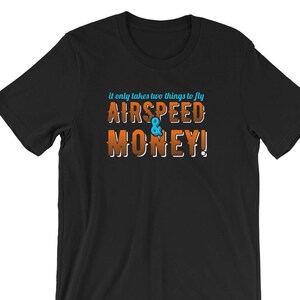 May include: Black t-shirt with orange text that reads "It only takes two things to fly: AIRSPEED & MONEY!"