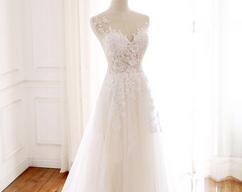 Yeta - elegant lace A-line wedding dress with illusion neckline.