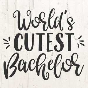May include: Black and white calligraphy text on a white wood background. The text reads "World's Cutest Bachelor".
