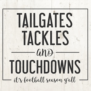 May include: Black and white sign with the text "Tailgates Tackles and Touchdowns - it's football season y'all".