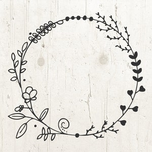 May include: Black and white floral wreath with a simple, delicate design. The wreath is made up of leaves, flowers, and vines.