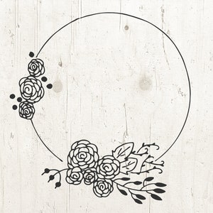 May include: A black and white floral wreath with a circle in the center. The wreath is made of stylized flowers and leaves.