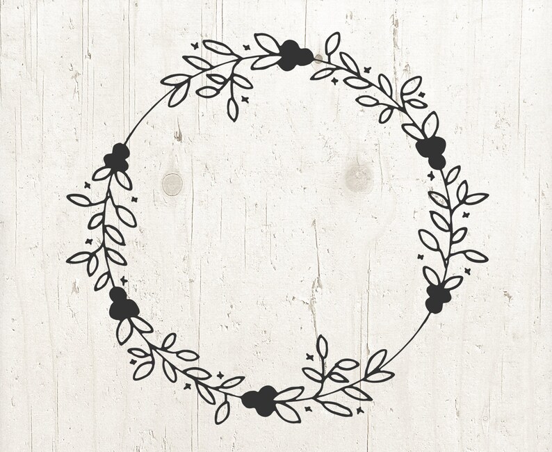 May include: A black and white wreath with a simple floral design. The wreath is made up of leaves and berries.