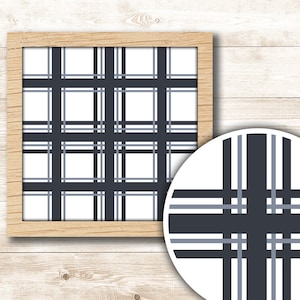May include: A framed black and white plaid pattern with a white background and black and grey lines. The frame is made of wood and has a light brown finish.