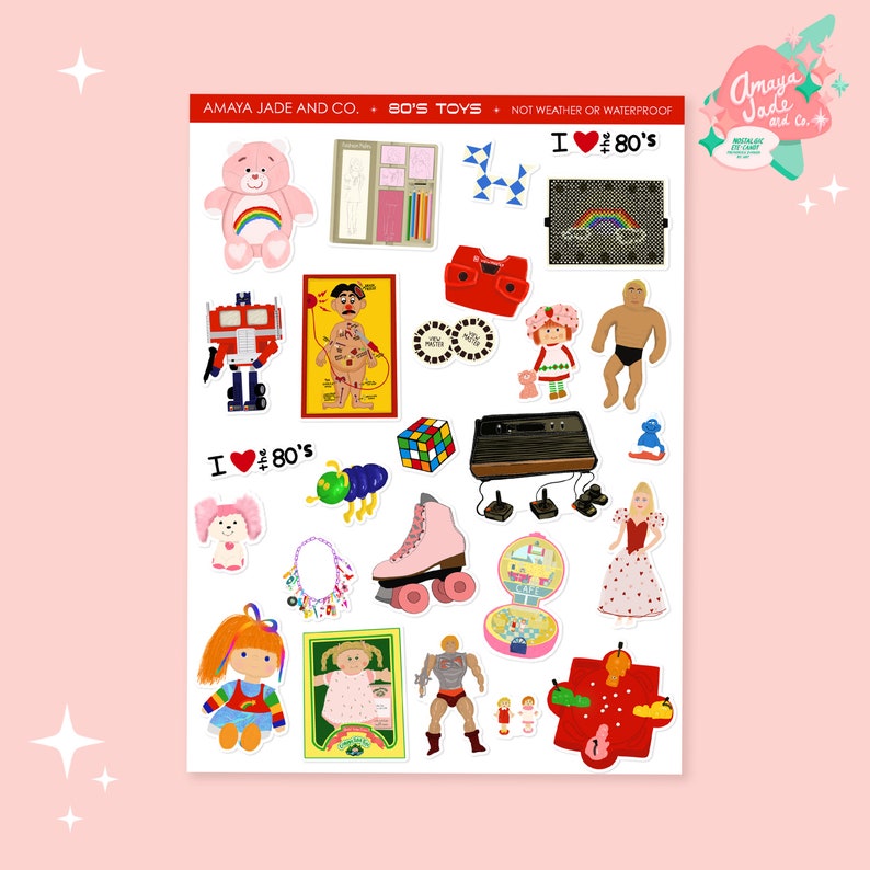 May include: A sticker sheet featuring various 1980s toys and icons. Includes a Care Bear, a Rubik's Cube, a Strawberry Shortcake doll, a roller skate, a Transformers robot, and a vintage video game console. The text "I ❤️ 80's" is also present.
