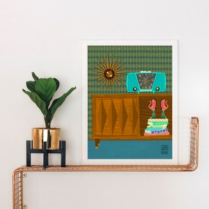 May include: A framed illustration of a mid-century modern living room with a teal radio, a wooden cabinet, a starburst clock, and a stack of books. The background is a green and blue geometric pattern.