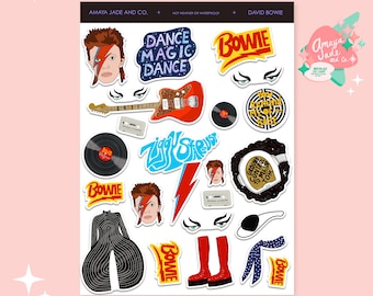 May include: A set of 15 David Bowie themed stickers featuring images of the musician, lyrics, and album covers. The stickers are printed on white paper and have a glossy finish.