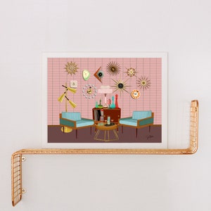 May include: A mid-century modern living room scene with two teal blue armchairs, a coffee table, and a record player cabinet. The pink wall is decorated with a variety of clocks in different shapes and styles.