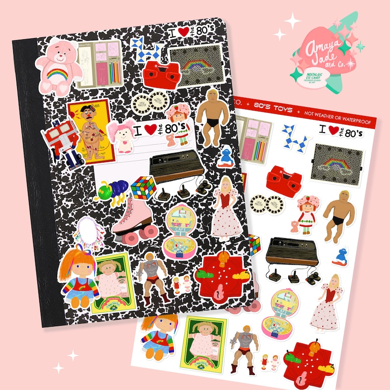 May include: A composition notebook covered in stickers with a black and white speckled pattern. Stickers include a Care Bear, a rainbow, a Rubik's Cube, a roller skate, and the text "I ❤️ 80's". A sheet of matching stickers is also present.