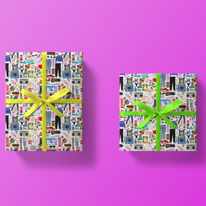 May include: Two gift boxes wrapped in white paper with a colorful pattern of 80s and 90s themed icons. One box has a yellow ribbon and the other has a green ribbon.