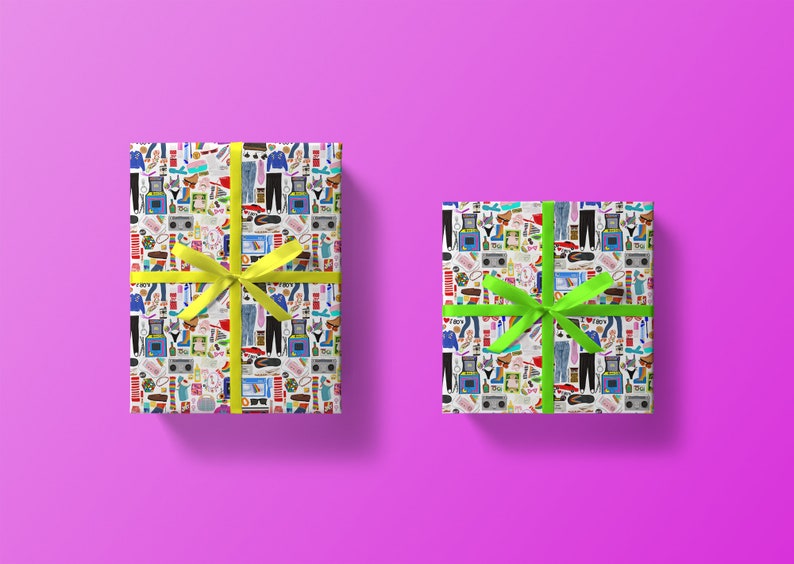 May include: Two gift boxes wrapped in white paper with a colorful pattern of 80s and 90s themed icons. One box has a yellow ribbon and the other has a green ribbon.