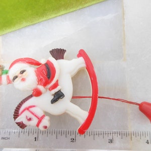 Vintage Christmas Santa Rocking Horse Brooch Pin Mechanical Plastic Kitsch Kitschmas Jewelry Gift HONG KONG Mid Century
