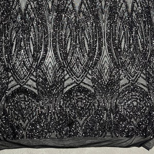 Könnte beinhalten: Schwarzer Paillettenstoff mit geometrischem Muster. Die Pailletten sind klein und dicht angeordnet, wodurch ein schimmernder Effekt entsteht.