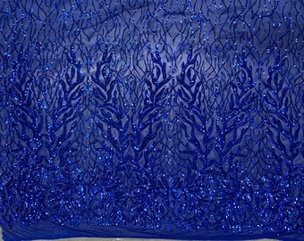 May include: Royal blue sequined fabric with a delicate, intricate pattern of branches and leaves. The sequins are evenly distributed and create a shimmering effect.