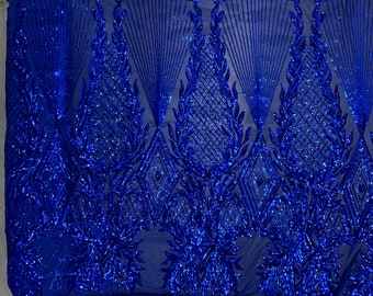 May include: Royal blue sequined fabric with a geometric pattern and leaf design. The sequins are iridescent and create a shimmering effect.