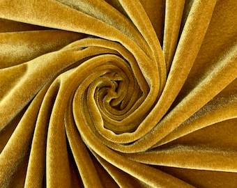 Peut inclure: Un gros plan sur un tissu de velours jaune doré, avec un motif en spirale tourbillonnant. Le tissu est doux et luxueux, avec un léger éclat.