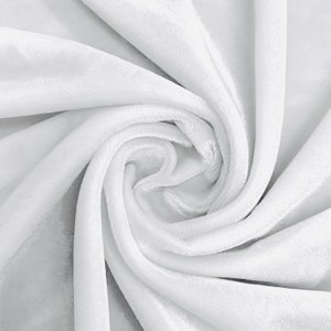 May include: White velvet fabric with a soft, smooth texture. The fabric is folded and draped, creating a swirling pattern.