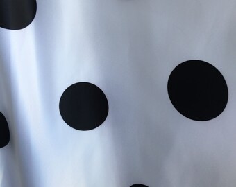 May include: White fabric with black polka dots. The fabric has a smooth, silky texture.
