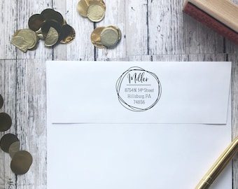 May include: A white envelope with a black and white return address label. The label has a circle with the text "Miller" and the address "8754 N. 14th Street Hillsburg, PA 74856".