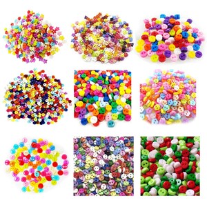 May include: A selection of multi-coloured buttons in different shapes and sizes. The buttons are in shades of red, yellow, green, blue, and purple. Some have two holes, others four. Suitable for sewing and craft projects.