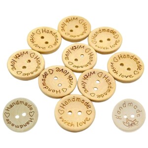 May include: A selection of light brown wooden buttons. Each button is round with two holes and the words "Handmade with love" engraved around the edge. A heart symbol is also included in the design.