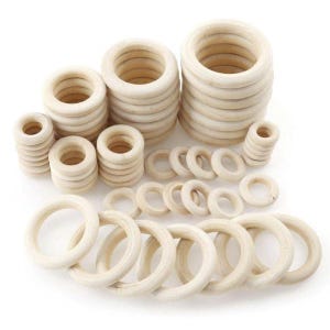 May include: A set of wooden rings in various sizes, ideal for crafting projects. The rings are made from natural wood and have a smooth, unfinished surface.