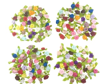 May include: Assortment of small, colorful satin ribbon roses with green leaves. The roses are arranged in four groups, each with a different color scheme.