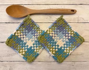Blue woven potholders, mug rugs, hot pads