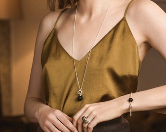 Adjustable raw natural amber pendant NERO