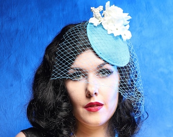 Stunning Aqua Blue Fascinator Hat with Handcrafted Birdcage Veil and Beautiful Floral Embellishments