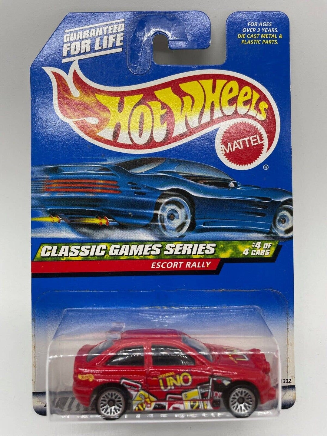 Hot Wheels Ford Escort Rally 1999 - Série Classic Games (4/4), Rouge Avec Jantes Chromées, Boîte Non Ouverte