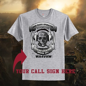 May include: Gray t-shirt with a skull wearing headphones and a microphone. The text reads "Ham Radio Operator it's not just a hobby It's a post apocalyptic survival skill WA4VXW Your call sign here".