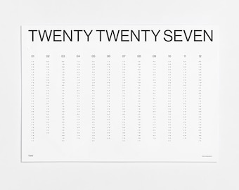 May include: A white wall calendar for the year TWENTY TWENTY SEVEN. The design features black text and twelve vertical columns labeled 01 through 12, each containing a list of dates represented by numbers and dots in a clean, linear layout.