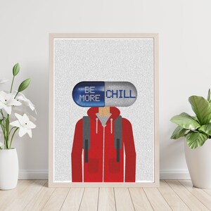 May include: A minimalist poster with a stylized illustration of a person wearing a red hoodie and a blue and gray pill over their head. The pill has the text "Be More Chill" printed on it.