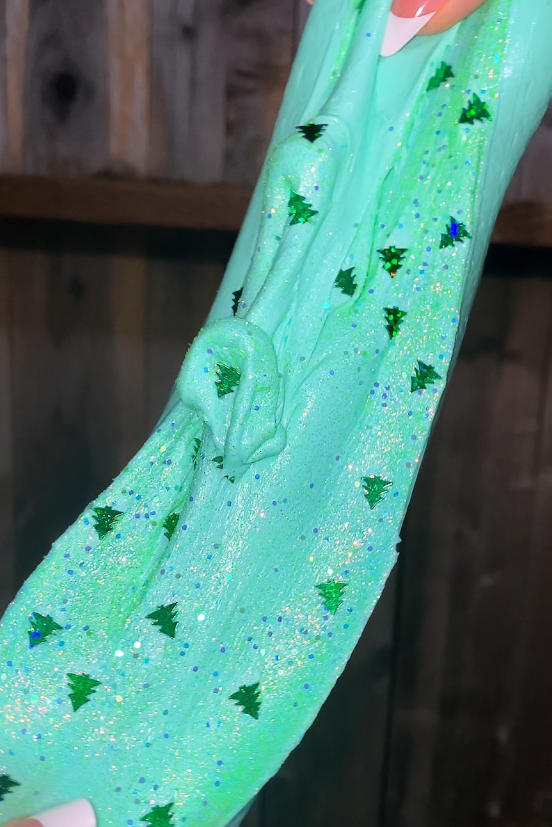 May include: Teal slime with green glitter shaped like Christmas trees.