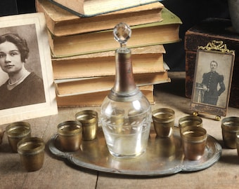 Set of vintage metal stemmed liquor glasses with tray