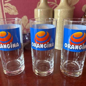 3 vintage Orangina glasses with orange logo, bistro advertising glass