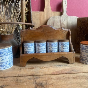 Vintage spice jars on wooden shelf, retro spice box, farmhouse kitchen