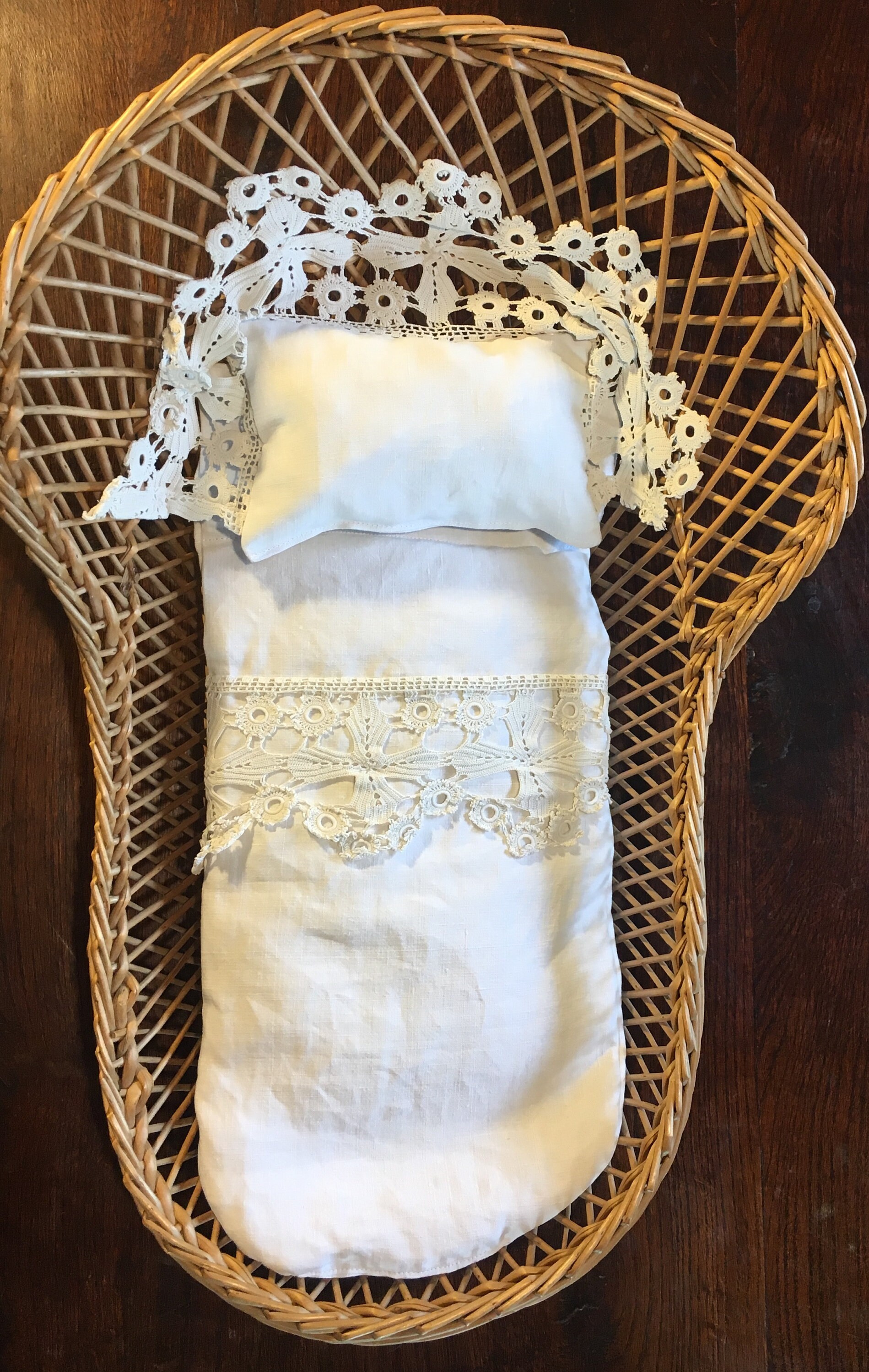 Rattan toy baby crib with French vintage linen