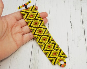 Ethnic beaded bracelet in yellow black olive Tropical summer jewelry Cool unique beadwoven cuff bracelet for women Artisan decor bracelet