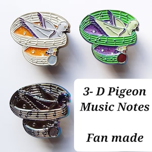 May include: Three enamel pins featuring a 3-D pigeon with music notes. The pins are in white, green, and iridescent colors. The text "3-D Pigeon Music Notes Fan made" is below the pins.