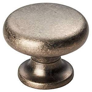 May include: A round, silver-toned cabinet knob with a slightly raised, smooth top and a smaller, rounded base.