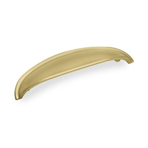 May include: A brushed gold cabinet pull with a curved shape.