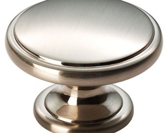 May include: A brushed nickel cabinet knob with a round top and a base. The knob has a smooth, polished finish.