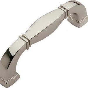 May include: A polished nickel cabinet pull with a curved design and square ends.