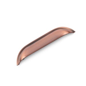 May include: A copper cabinet pull with a curved, slightly rounded shape. The pull has a brushed finish.
