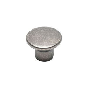 May include: A round, silver-toned cabinet knob with a slightly textured finish.