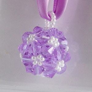 Victorian purple woven ball ornament has color-change