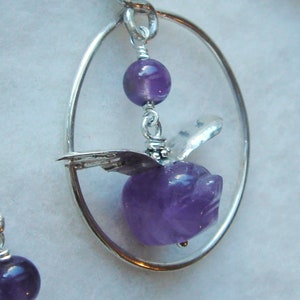 Flying Pig earrings are Carved Amethyst with sterling wings on wires