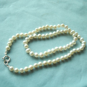 18&quot;white 6mm pearl necklace has sterling clasp